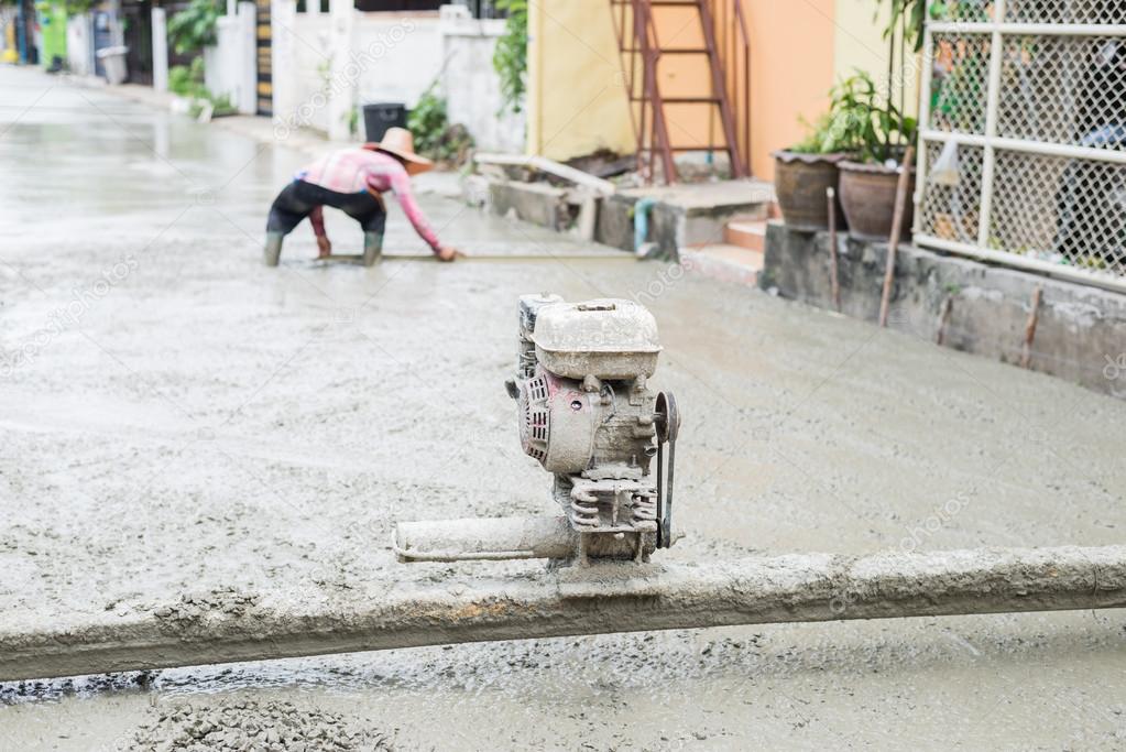 Construction series: Worker constructing cement road