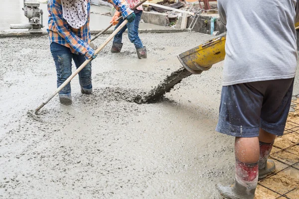 Construction series: Workers constructing cement road