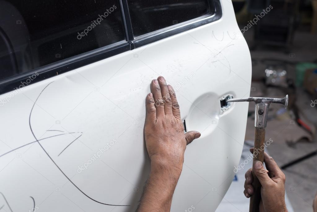 Auto Body Repair Series Mechanic Fixing Dented Car Door Stock