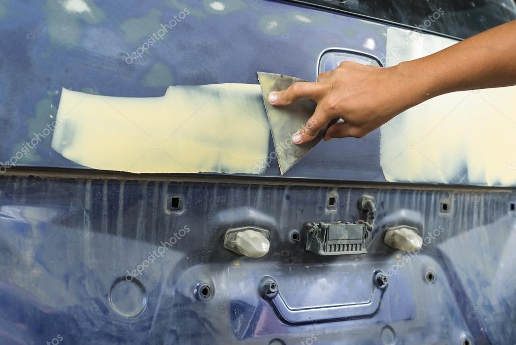 Auto Body Repair Seires Working On Putty Filler Stock Photo