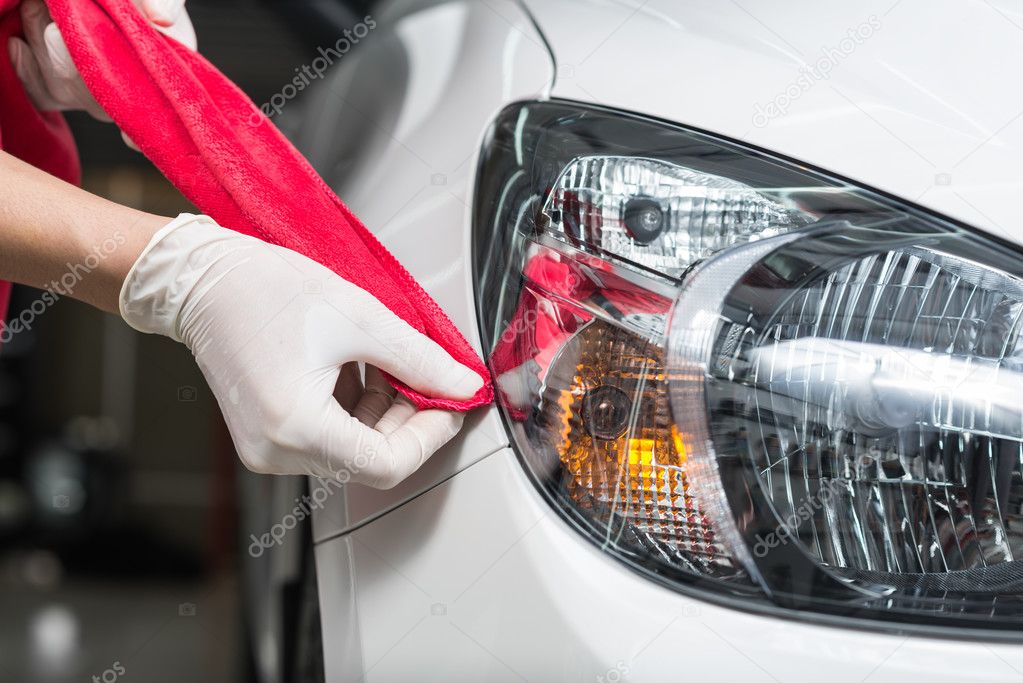 Car detailing series : Worker waxing white car