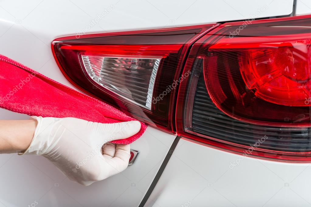 Car detailing series : Worker waxing white car