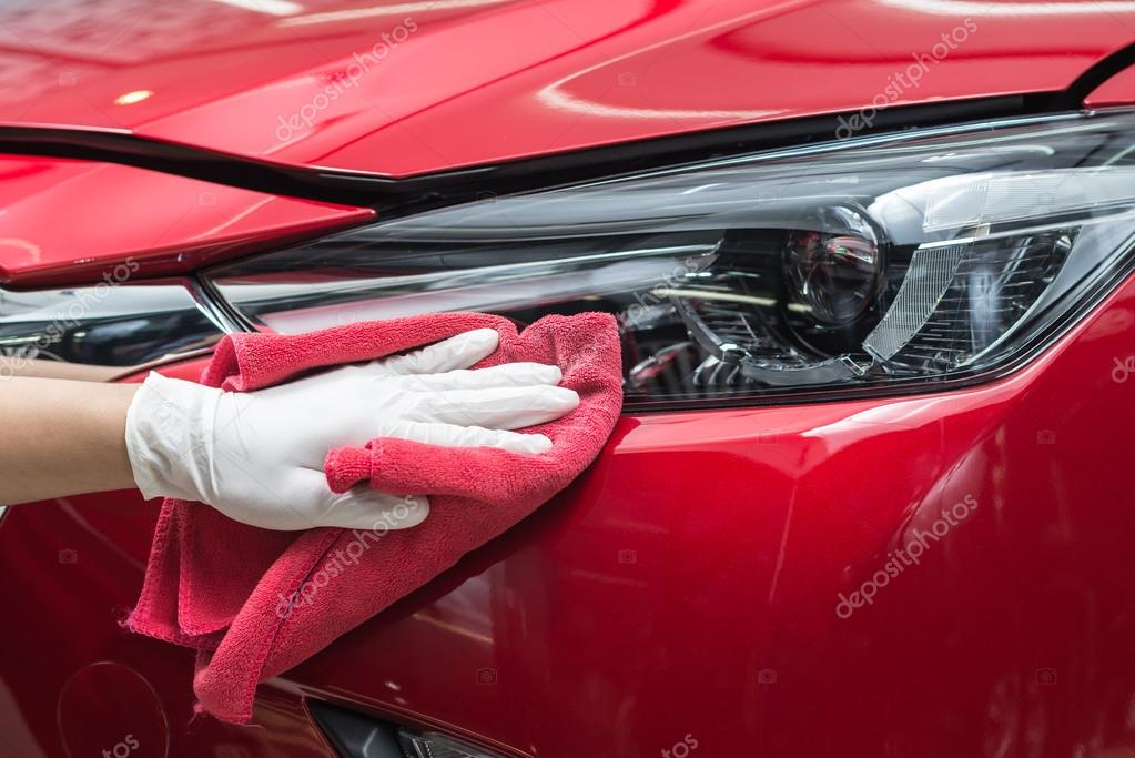 Car detailing series Worker cleaning red car Stock Photo by 103242736