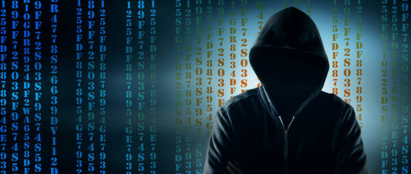 Cybersecurity, computer hacker with hoodie