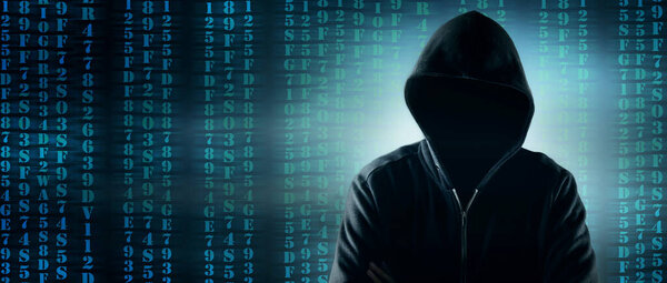 Cybersecurity, computer hacker with hoodie