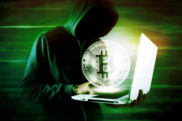 Hacker man using laptop and computer with Bitcoin