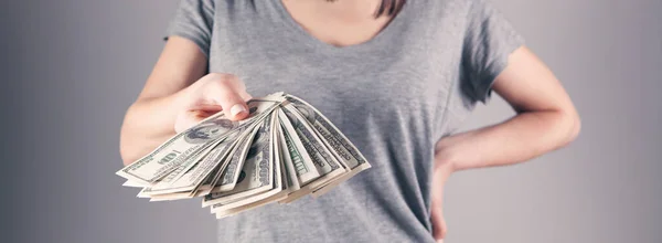 girl holding big money in her hands