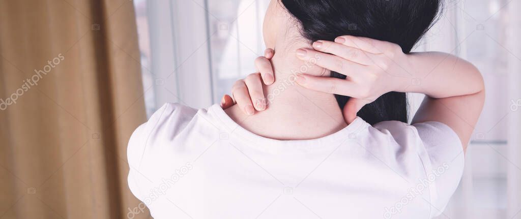 close-up on a woman's hand massaging her neck. Girl's neck hurts