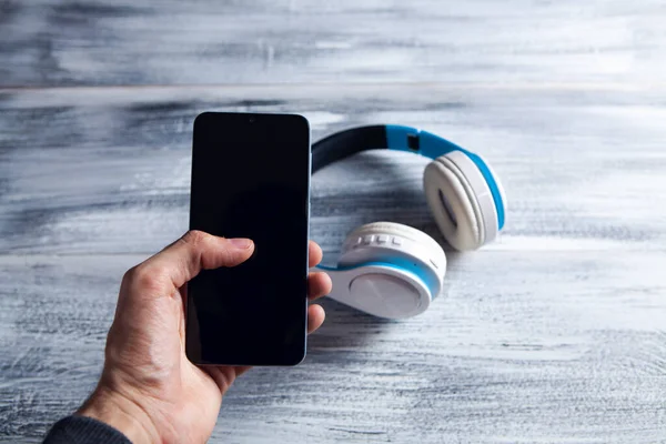 headphones and phone on the table