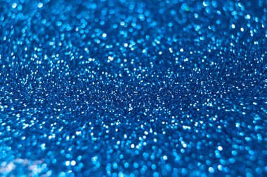 Mavi parıltılı dokular, noel arkaplanı soyut. Odaklanmamış ışıklar bokeh.