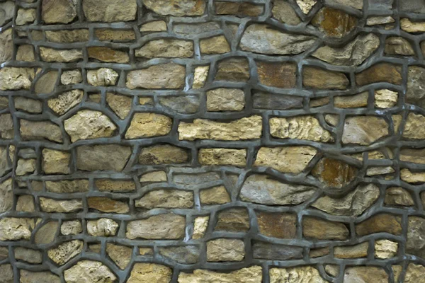 A wall of stacked stones — Stock Photo, Image