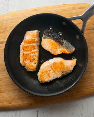 Rice paella with vegetables and salmon. Step-by-step recipe to learn how to cook.