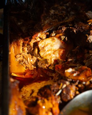 Authentic cochinita pibil recipe in a dish and tacos typical of the Yucatan Peninsula in Mexico.