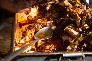 Authentic cochinita pibil recipe in a dish and tacos typical of the Yucatan Peninsula in Mexico.