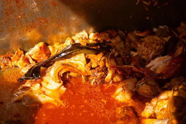 Authentic cochinita pibil recipe in a dish and tacos typical of the Yucatan Peninsula in Mexico.