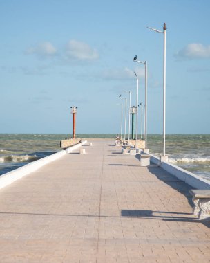 El Cuyo, Mexico; November 1, 2025: Footbridge leading to the sea in a Yucatan fishing village.