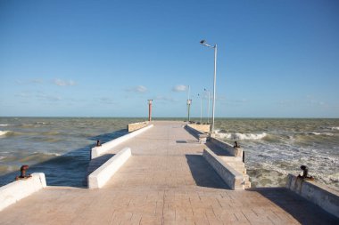 El Cuyo, Mexico; November 1, 2025: Footbridge leading to the sea in a Yucatan fishing village.