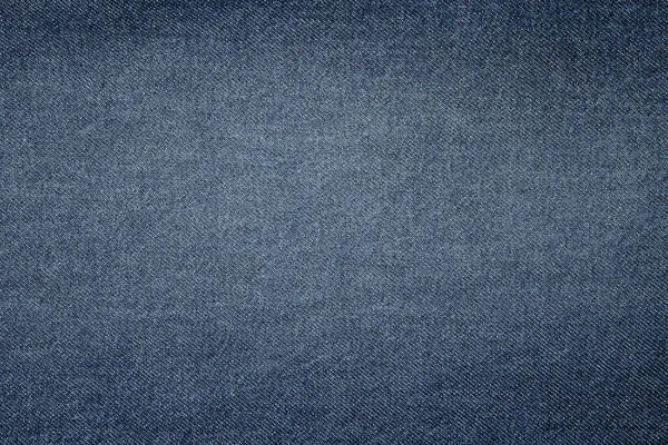 Blå bakgrund, jeans bakgrund. Jeans struktur, tyg. Texture Jeans. Närbild av blå jeans tyg makro med yttre sömmar gul — Stockfoto