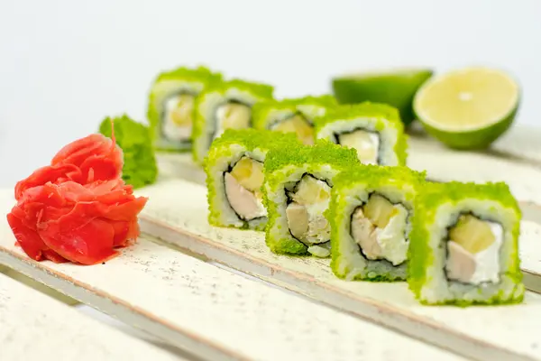 Japanese cuisine - sushi roll with tuna, salmon, conger and flying fish roe, selective focus — Stock Photo, Image