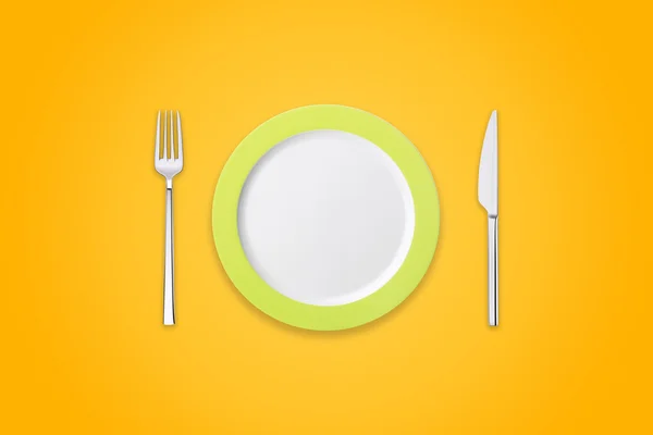 Placa con tenedor y cuchillo sobre fondo naranja —  Fotos de Stock