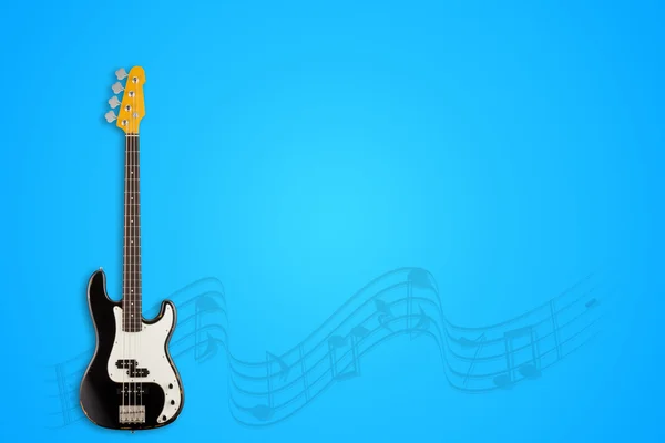 Guitarra e notas sobre fundo azul — Fotografia de Stock