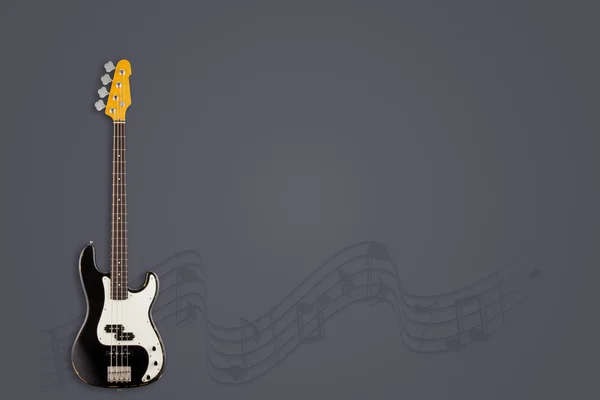 Gitarre und Noten auf raumgrauem Hintergrund — Stockfoto