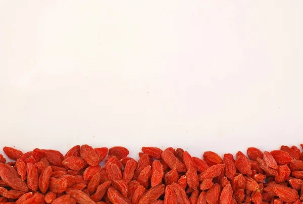 Chinese goji on the long side on the white background — Stock Photo, Image