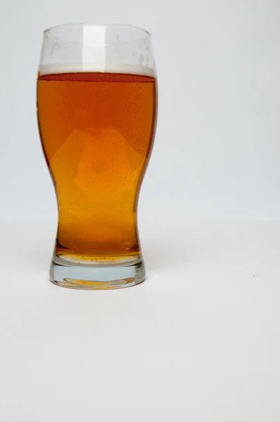 Glass of light beer isolated on a white background — Stock Photo, Image