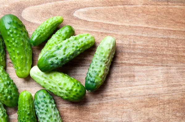 The image of fresh cucumber on a wooden table — Stock Photo, Image