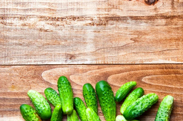 The image of fresh cucumber on a wooden table — Stock Photo, Image