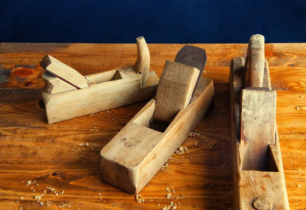 Planer carpenter on a wooden background — Stock Photo, Image