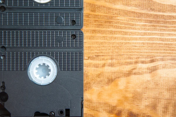 Cassetes VHS em uma mesa de madeira — Fotografia de Stock