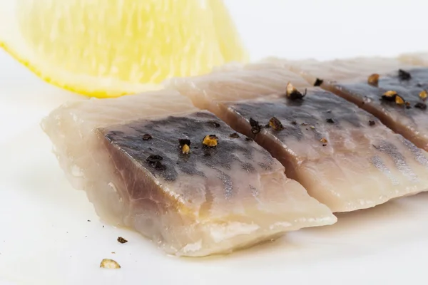 Sliced herring with lemon — Stock Photo, Image