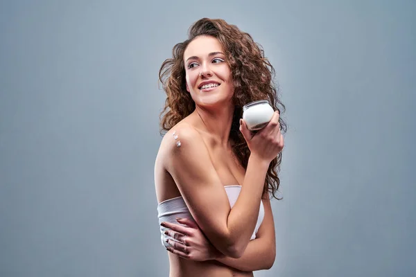 Beautiful Nourished Woman Holding Cream Her Skin Isolated Grey Background — Stock Photo, Image