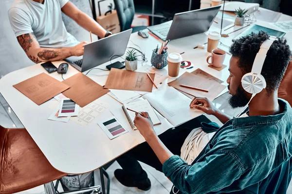 Group of multiethnic busy people working in an office. High angle shot