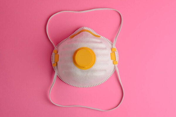 Protective mask on a pink background.