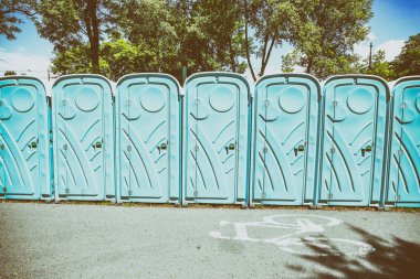 Vintage. View of the portable public toilets, old film effect clipart