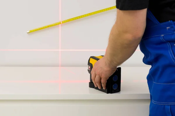 lines on the wall marked by an electronic laser used to determine angles during construction measurements and interior finishing works