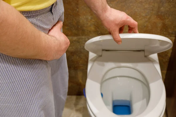 Man Pajamas Standing Toilet Holding His Abdomen Concept Problems Prostate — Stock Photo, Image