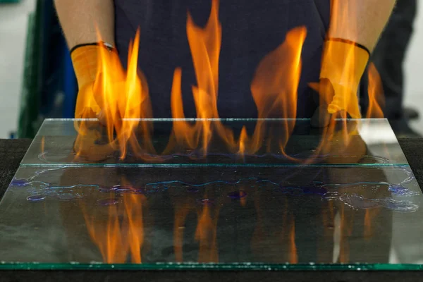 Burning glass, Laminated VSG material, Cut in a workshop. A specialist burns through the foil breaking the glued glass