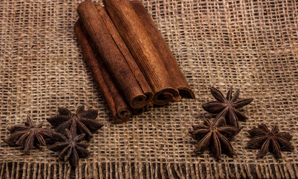 Cinnamon sticks and star anise at sacking — Stock Photo, Image