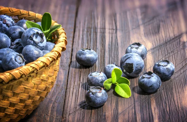Blueberries on a old wooden table — Stock Photo, Image