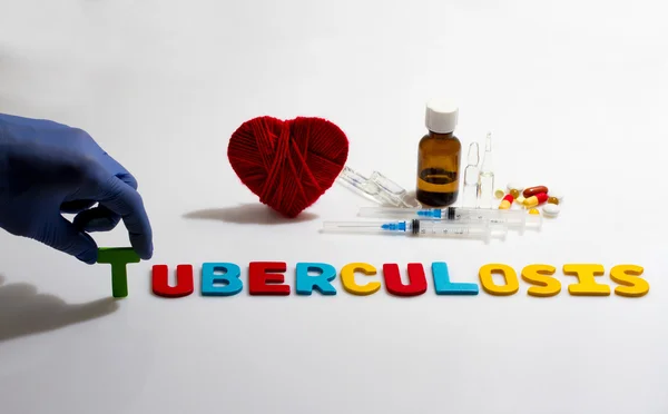 Palabra de mano y tuberculosis sobre el fondo blanco — Foto de Stock