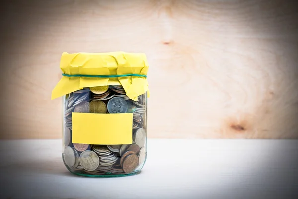 Coins in a glass jar — Stock Photo, Image