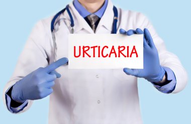 Doctor keeps a card with the name of the diagnosis - urticaria clipart