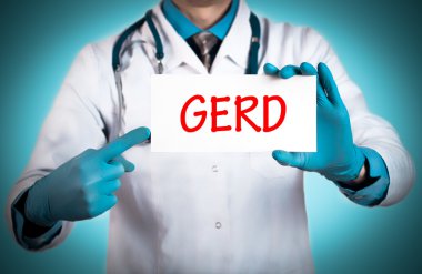 Doctor keeps a card with the name of the diagnosis - gerd clipart