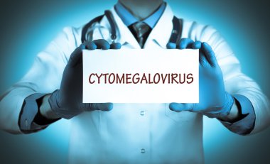 Doctor keeps a card with the name of the diagnosis - cytomegalovirus clipart