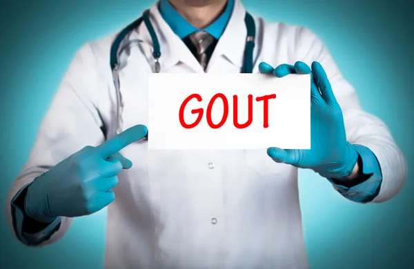 Doktor bir kartı ile tanı - gut adını tutar — Stok fotoğraf