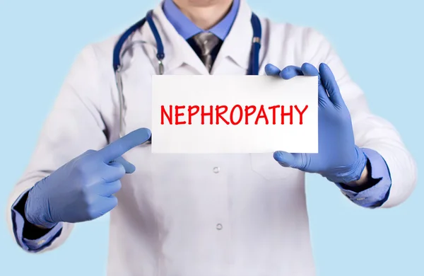 El médico guarda una tarjeta con el nombre del diagnóstico - nefropatía —  Fotos de Stock