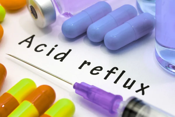 Acid reflux - diagnosis written on a white piece of paper — Stock Photo, Image